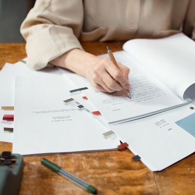 Woman reviewing a manuscript